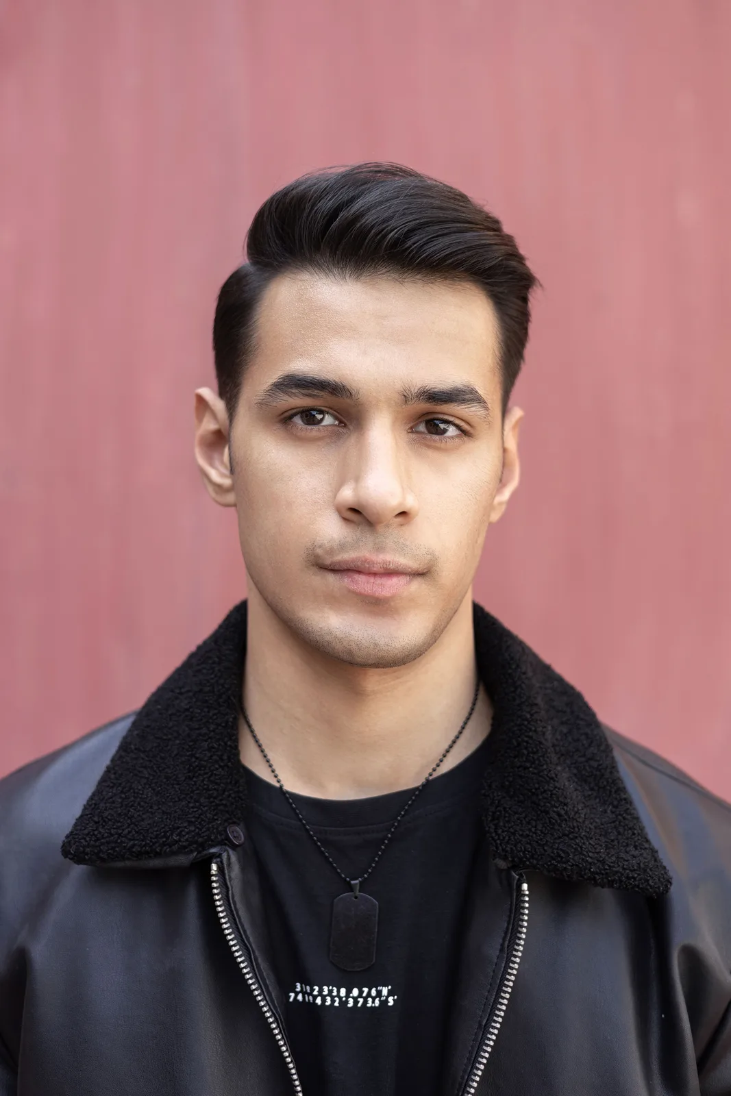 Sagar Shabbir headshot, front-facing in leather jacket