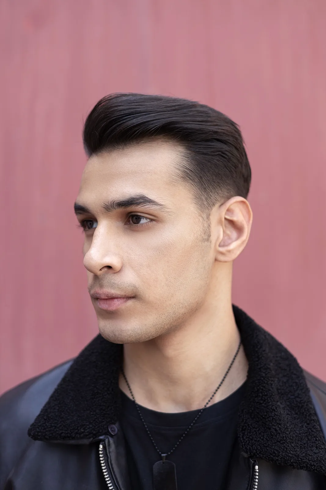 Sagar Shabbir three-quarter headshot in leather jacket