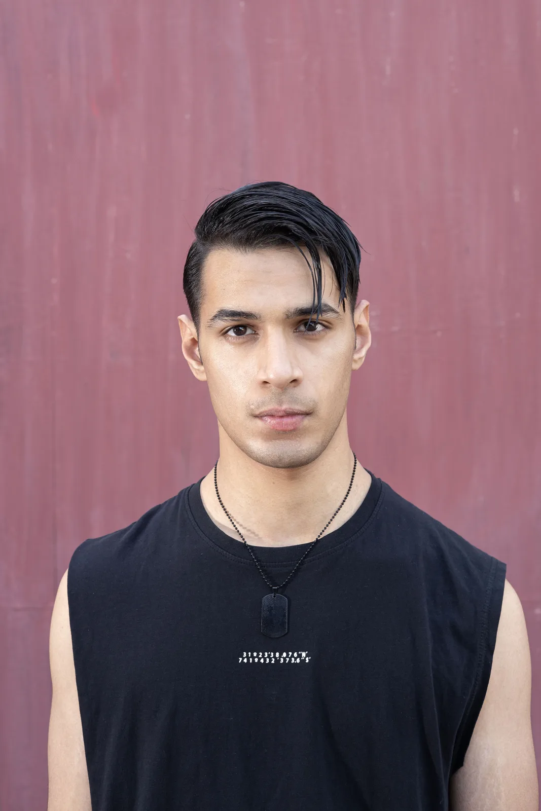 Sagar Shabbir headshot, sleeveless black top